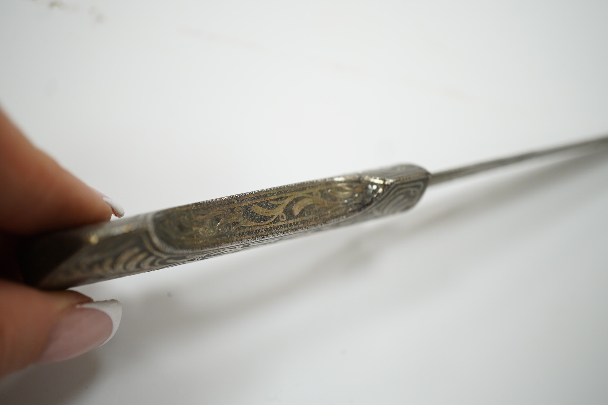 An Ottoman silver damascened dagger c.1900 in matching sheath, blade 9.7cm. Condition - fair